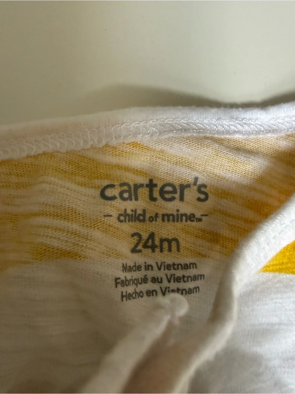 Two Carter's rompers- Striped Dino & Yellow Striped Baby 24m